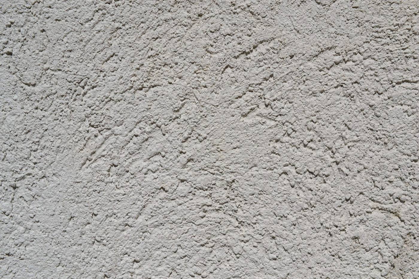Beige Fassadenputzfläche mit grober Körnung